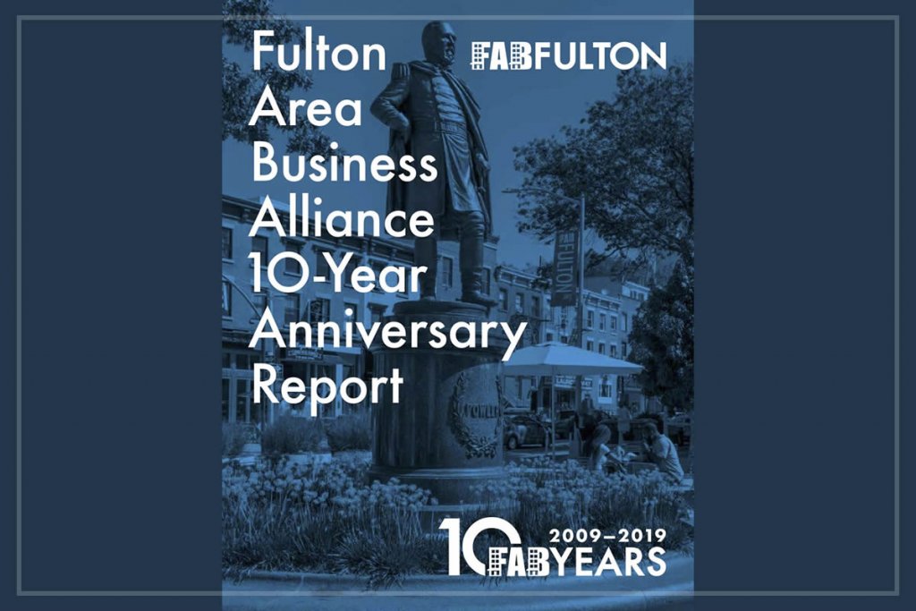 A graphic cover of the Fulton Area Business Alliance 10-Year Anniversary Report with blue filter over image of statue in Fowler Plaza with Fulton Avenue streetscape in the background.
