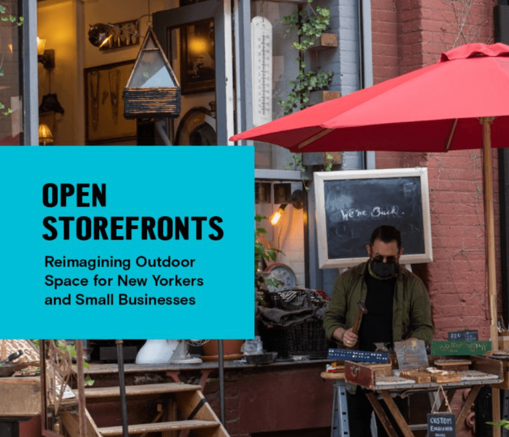 Open Storefronts text next to scene of man sitting at an outdoor table with umbrella overhead