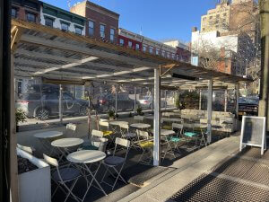photo of empty outdoor street seating at a restaurant
