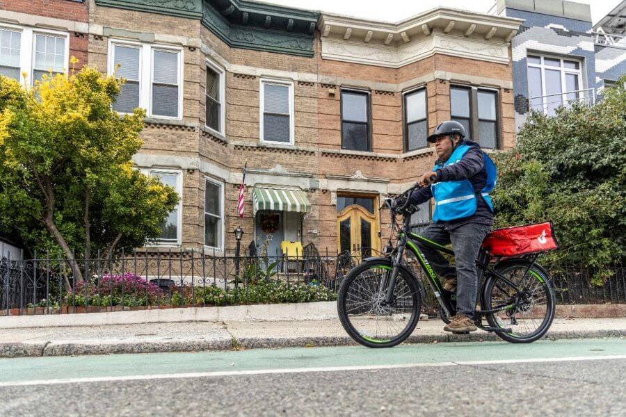 Bike delivery person riding in Brooklyn